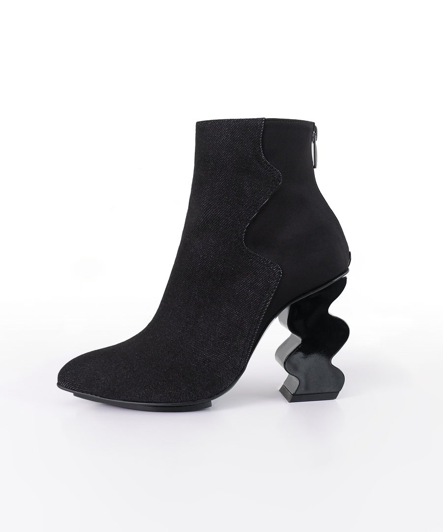 Black INES denim ankle boot with iRi's unique Dancing heel design on a white background