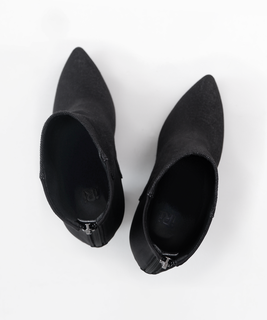 Black INES denim ankle boot with iRi's unique Dancing heel design on a white background