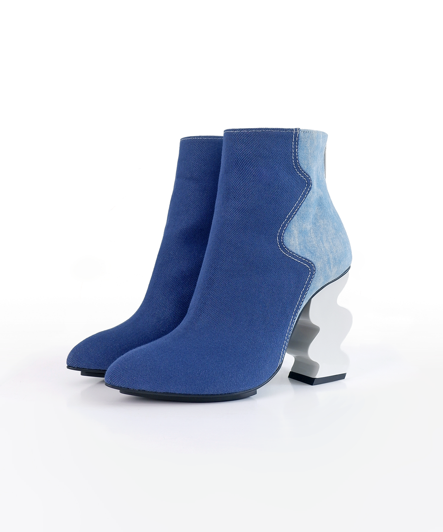 Blue recycled denim ankle iRi boot with a unique white heel on a white background