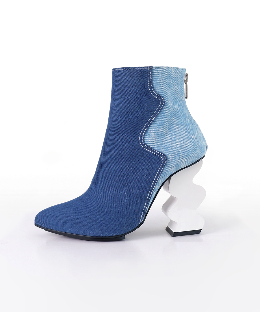 Blue recycled denim ankle iRi boot with a unique white heel on a white background