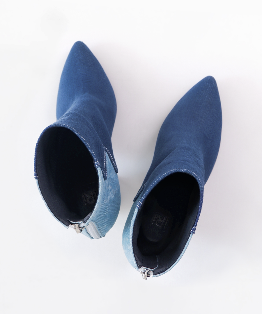 Blue recycled denim ankle iRi boot with a unique white heel on a white background